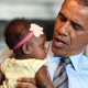 President Barack Obama cradles a baby during a visit to the Charcoal Pit restaurant in Wilmington, Del., on July 17, 2014.
JEWEL SAMAD/AFP/Getty Images